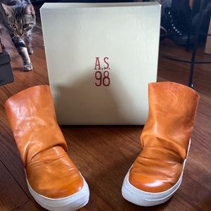 Free People AS98 leather tennis shoe “booties.”